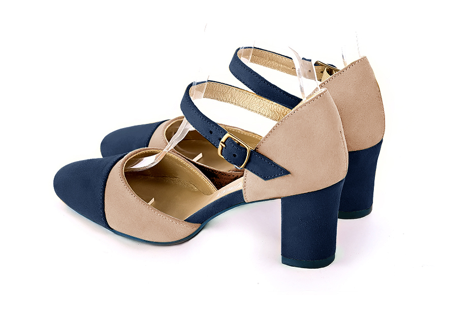 Women's navy blue and biscuit beige open side dress shoes, with an instep strap. Round toe. Medium block heels - Rear view